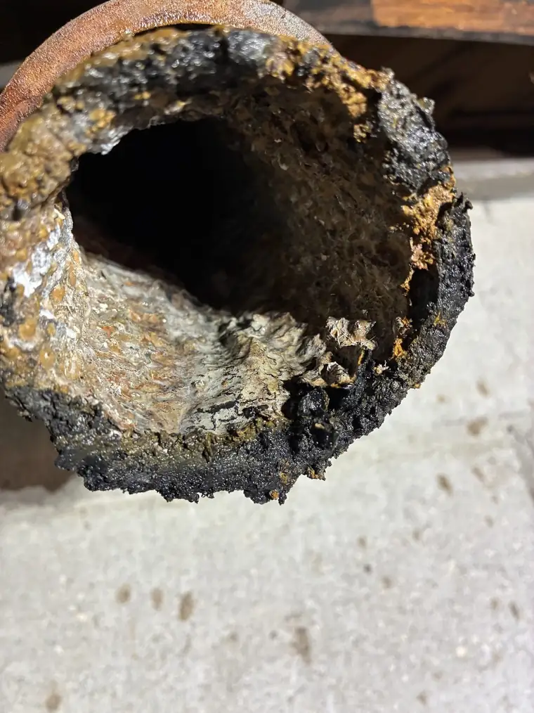 Heavily corroded cast iron drain pipe removed from a St. Petersburg home